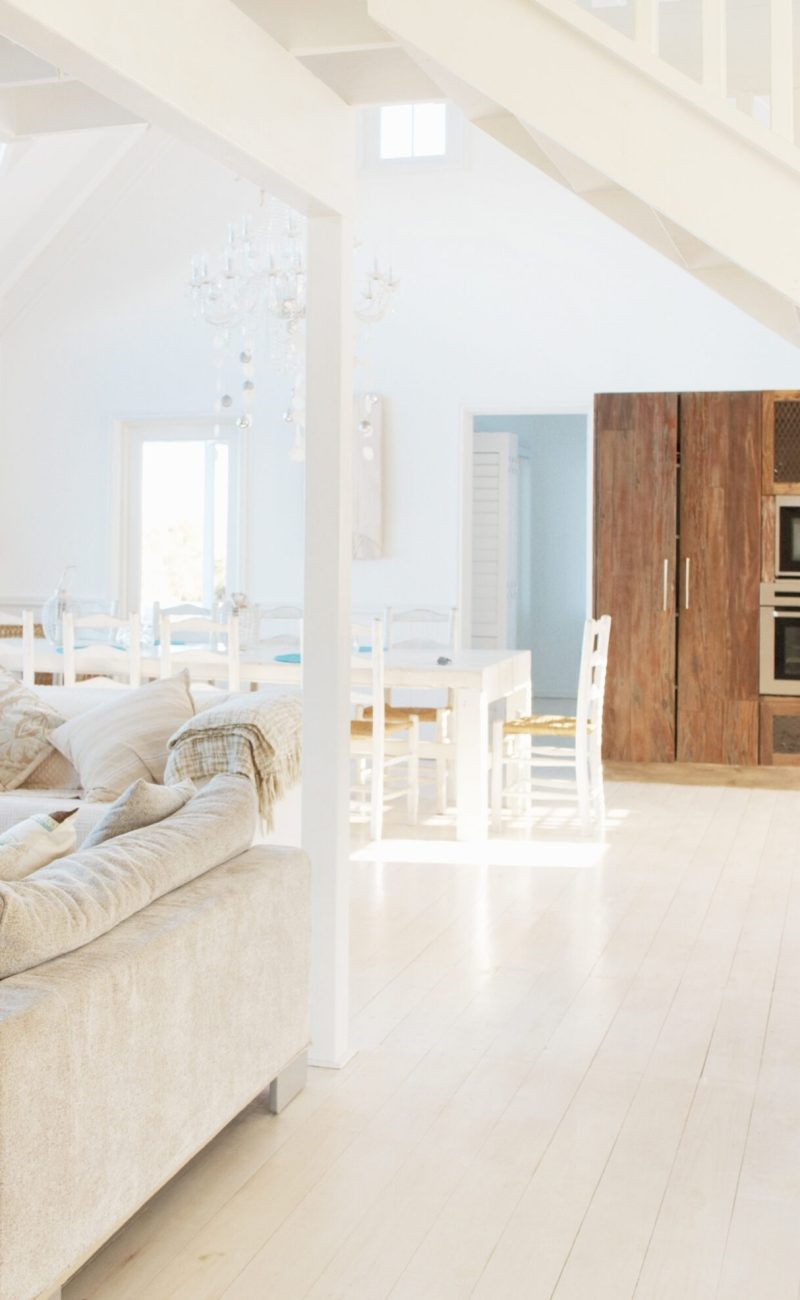 Spacious modern white interior of a modern home with bright natural light.